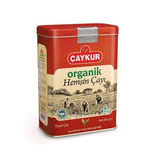 Çaykur Organik Hemşin Çayı teneke kutusunda 400 gr, yeşil ve kuru çay yapraklarıyla dolu doğal çay paketi.