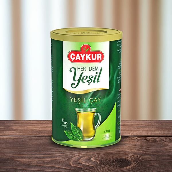 ÇAYKUR yaprak yeşil çay teneke kutu, 150 gram, yeşil yaprakların görünümü ve kutu tasarımı.